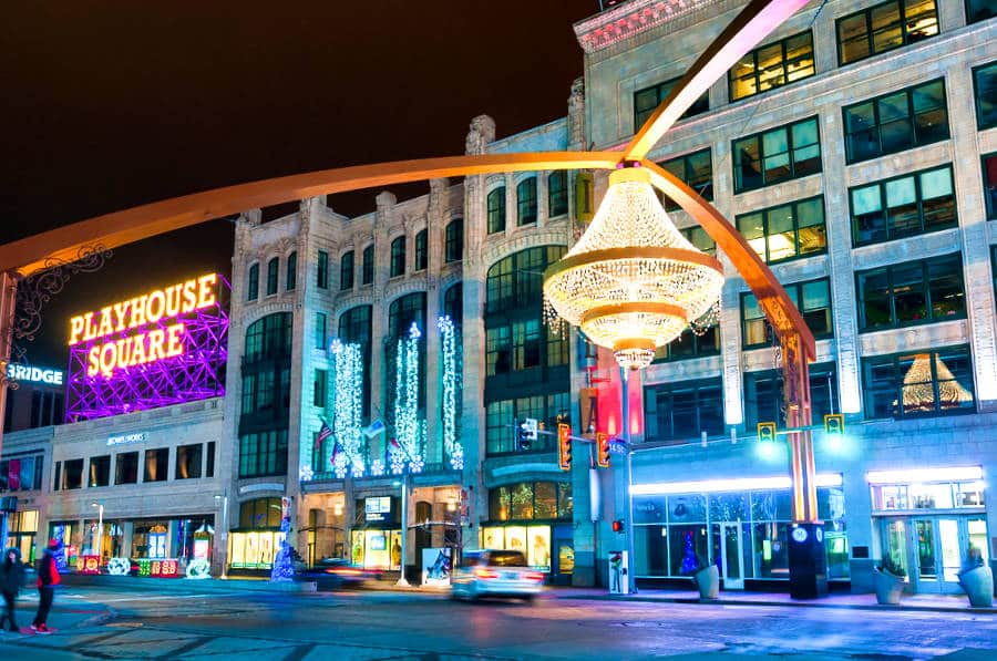 View of the illuminated signage of Playhouse Square and the giant chandelier above Euclid Avenue at night