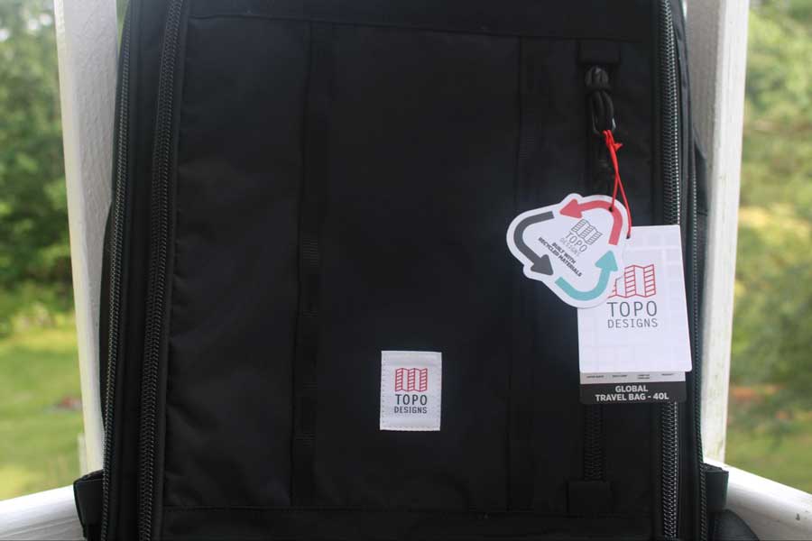 Close up view of the Topo Designs Global Travel Bag that shows that it is made of recycled materials