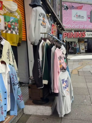 Various clothing items on display at a store in Shinsaibashi