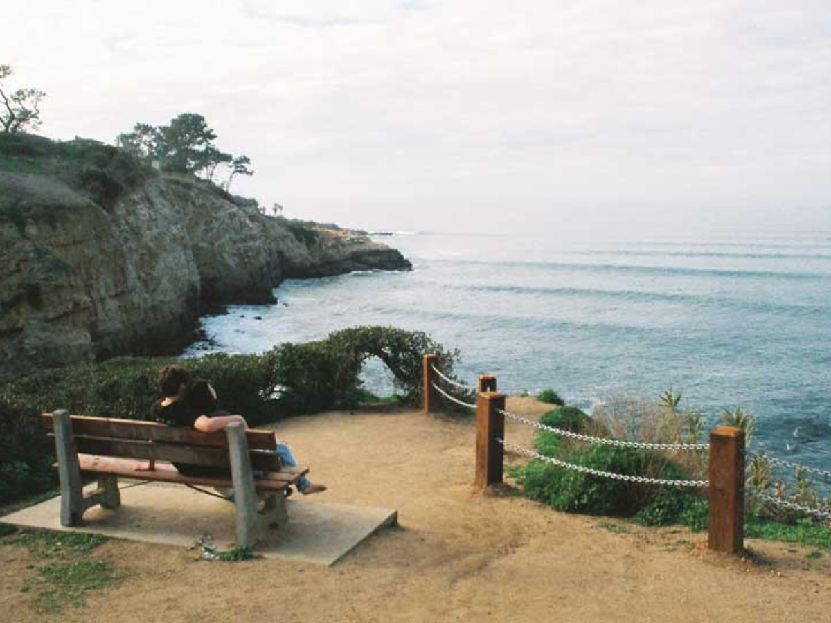 A couple admiring the view at the Coast Walk Trail