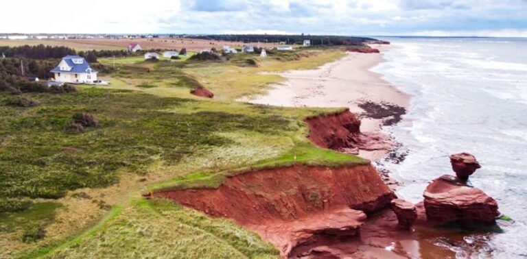 Coastal landscape showcasing red rock formations in Prince Edward Island