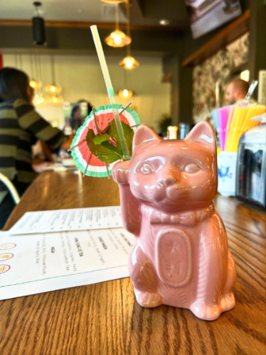 A cocktail drink on a cute pink cat glass from MAKfam