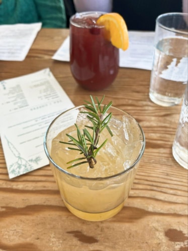 Glasses of two different cocktails from Pineridge Hollow