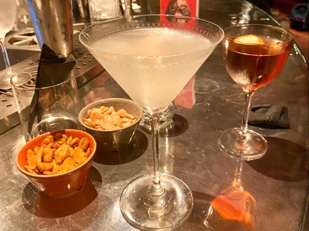 Glasses of hand-crafted cocktails on a table at The Bloomsbury Club