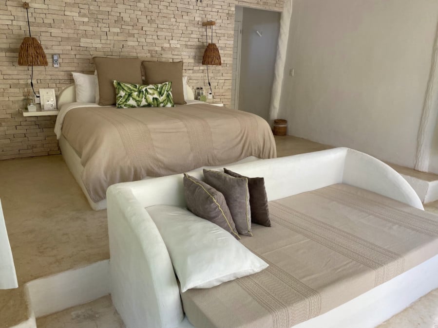 The bed in Coco Limited Tulum Hotel