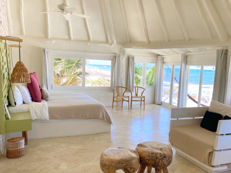 View of the bedroom with an ocean view