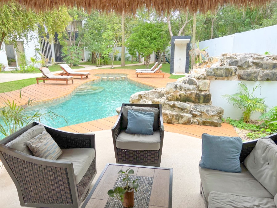 Seating area and pool at Coco Village Tulum
