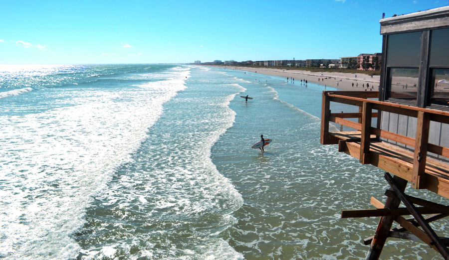 View of surfers in the Cocoa Beach in Florida