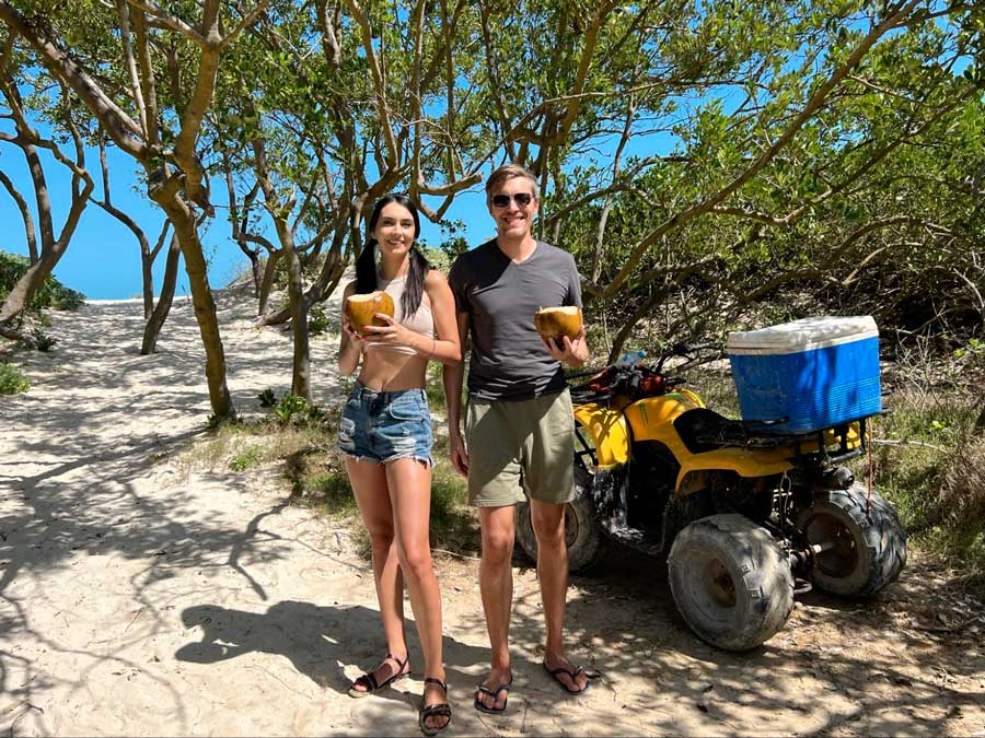 Nate and Clara holding a coconut water in Las Coloradas