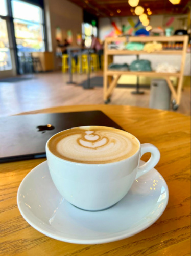 A cup of coffee on a table at Huckleberry Roasters