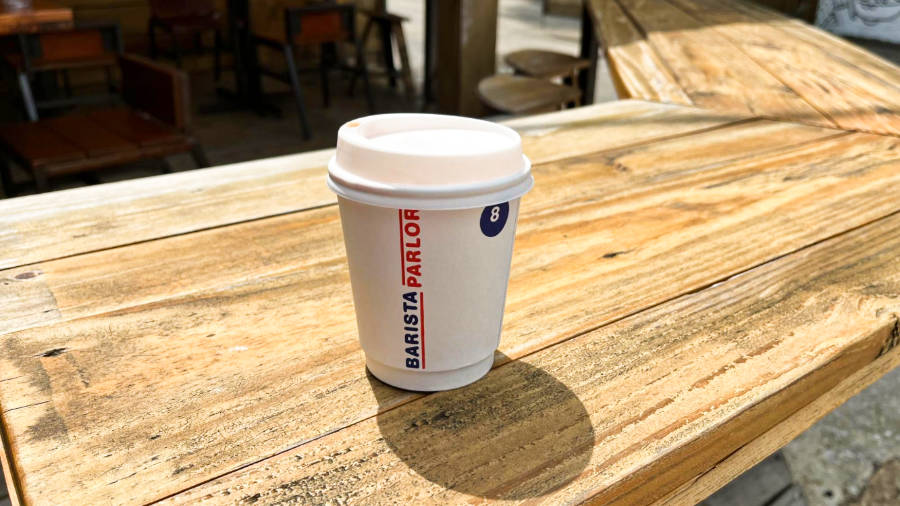 A cup of coffee on the wooden table
