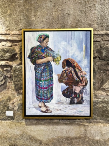 View of the displayed painting of two women in traditional clothing
