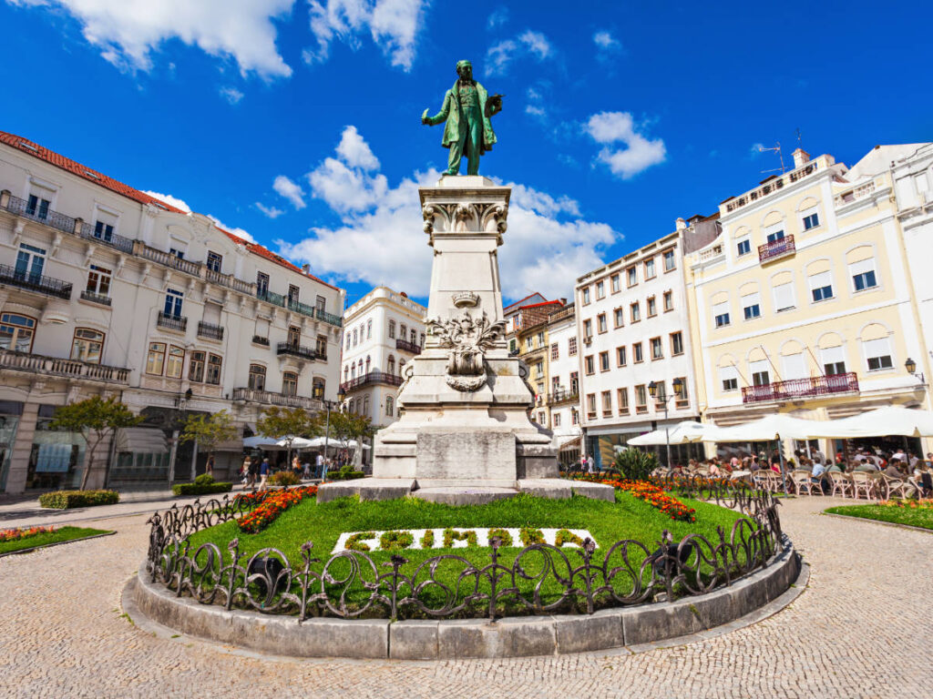 A statue under the blue sky in Coimbra, Portugal