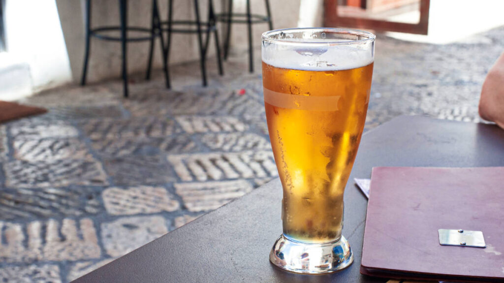 View of a cold pint of beer placed on the table