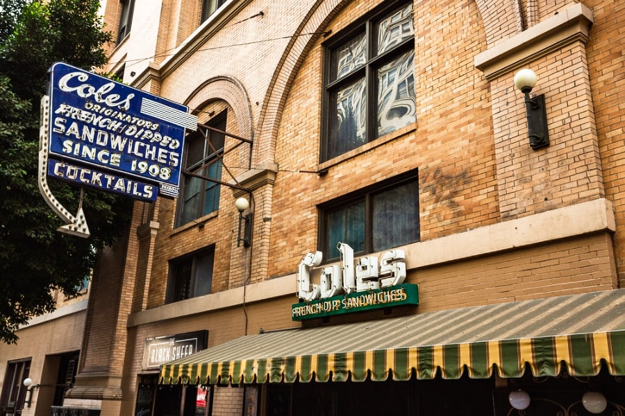 Exterior and neon sign view of an old French inspired restaurant of Cole’s French Dip