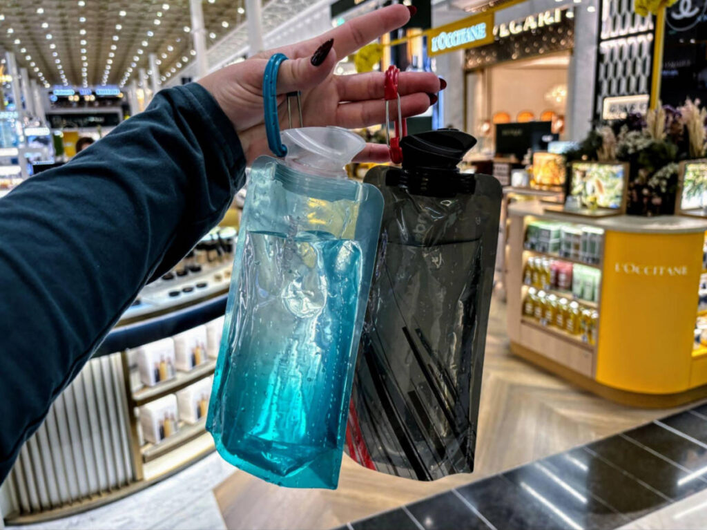 Two refilled collapsible water bottles at the CDG airport