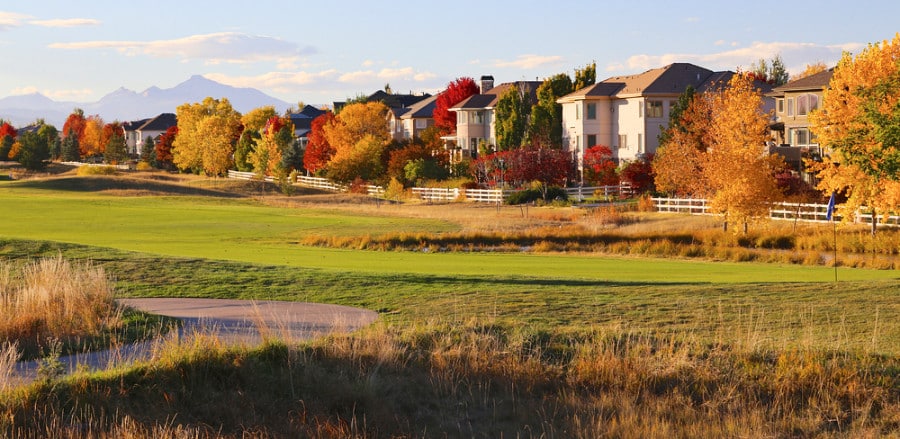 View of the houses from a field in autumn