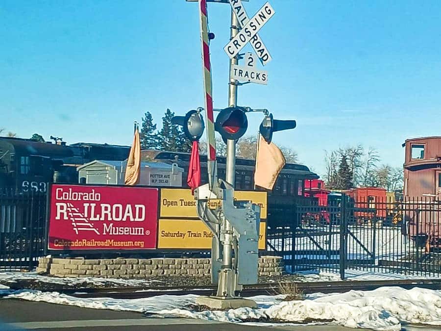 View of the stop light at the railroad crossing of Colorado Railroad Museum