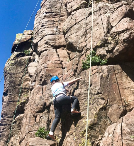 A woman doing rock climbing in Colorado