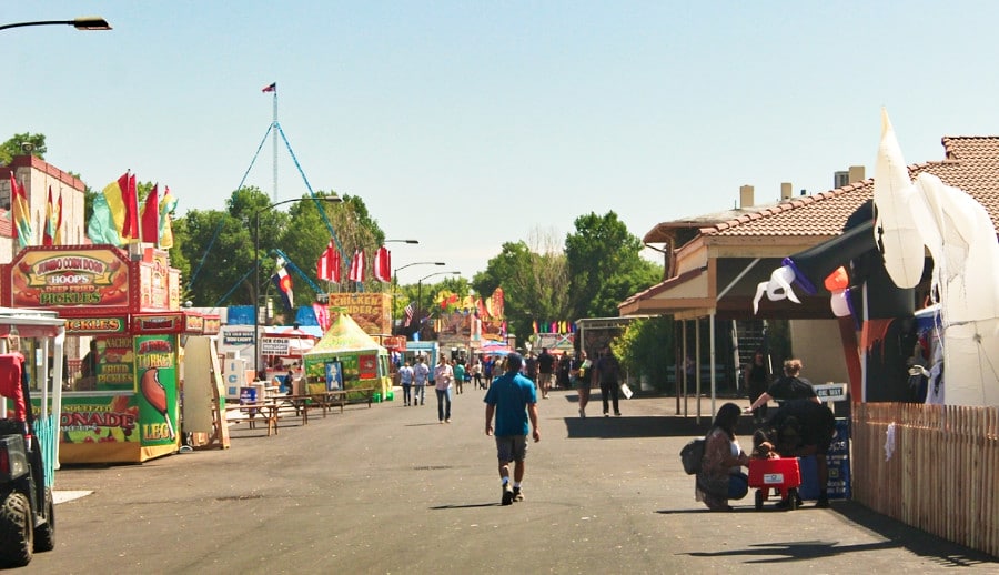 View of people strolling around the games and food stalls at the Colorado state fair