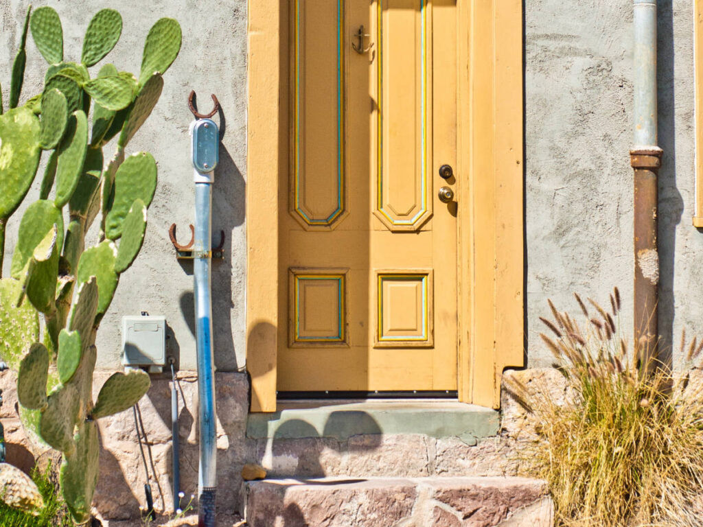 A bright yellow door on a house in Sam Hughes