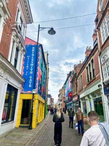 View of the people wandering around the colorful street of Nottingham