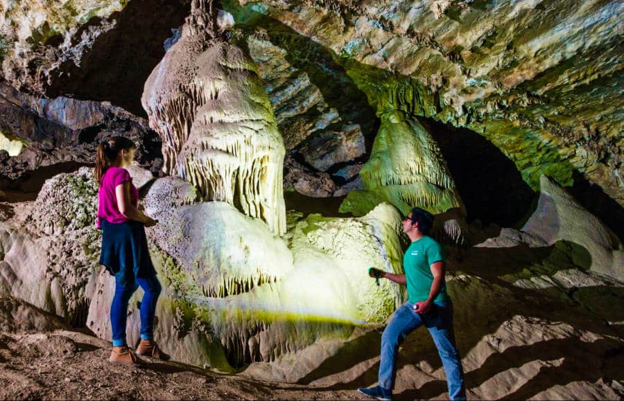 The author (Betty Hurd) and her friend examining a unique formation near Colossal Cave Mountain Park