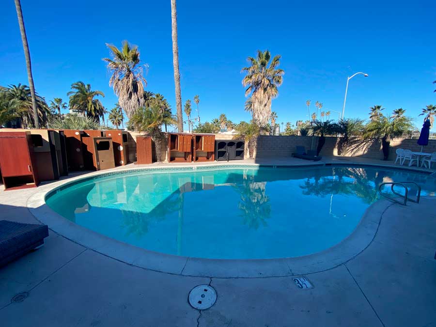 View of a pool and the clear blue sky in Comfort Suites