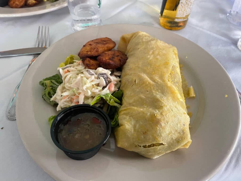 A Conch roti on a plate served on a restaurant in Tortola