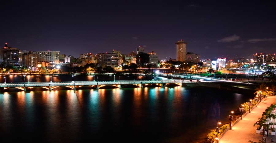 Overlooking view of the Condado Lagoon and the buildings around it at night