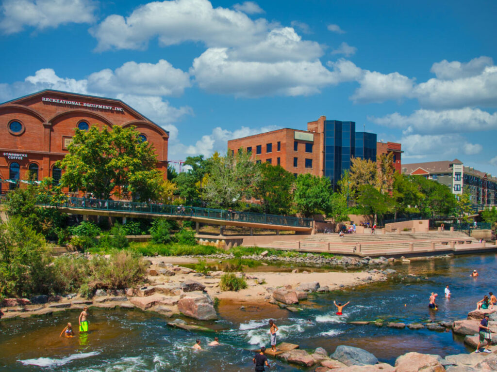 People swimming in the clear waters of Confluence Park
