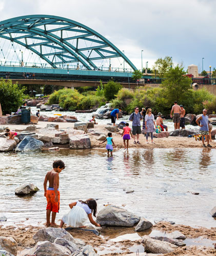 View of people in Confluence Park during summer season in Denver
