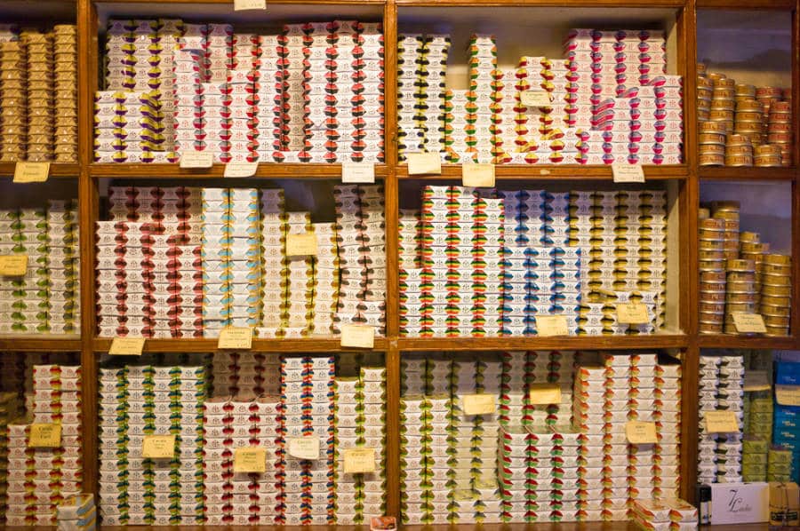 Colorful packaging of canned sardines displayed on the shelves of a local store in Lisbon