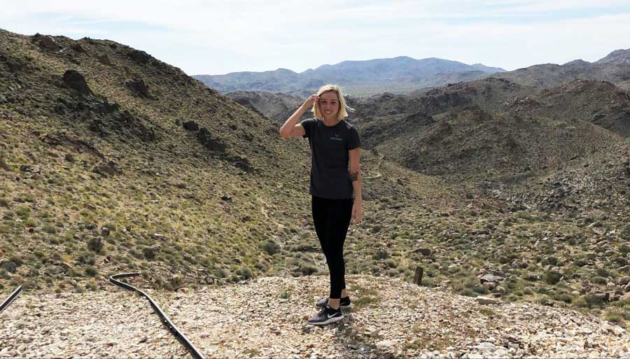 The author and the abandoned tracks of Contact Mine Trail on her side