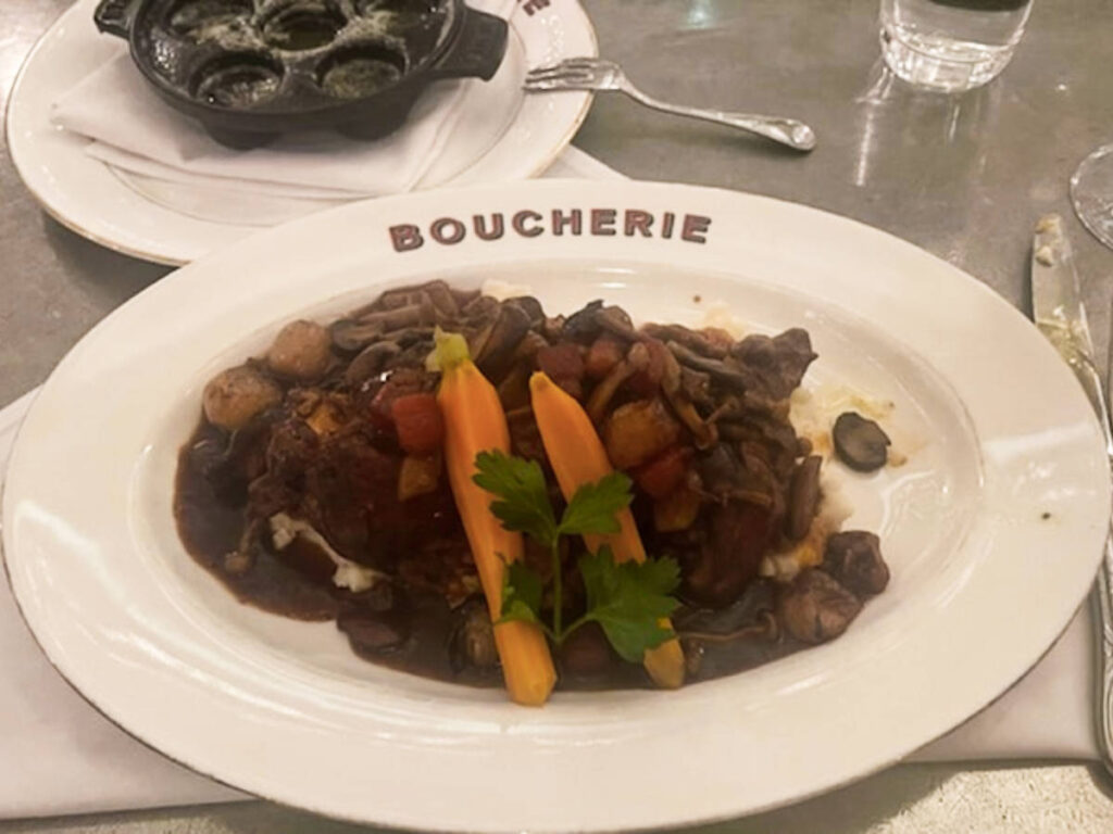 A plate of oven braised chicken with vegetables and mashed potato from Boucherie