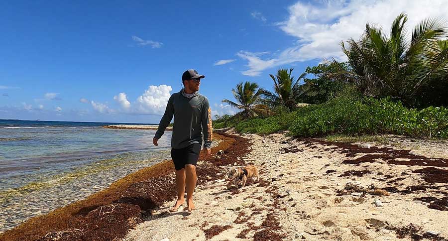 The author walking on the shoreline of Limestone Beach