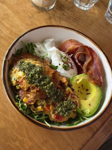A bowl of Corn + zucchini fritters at HEARTS