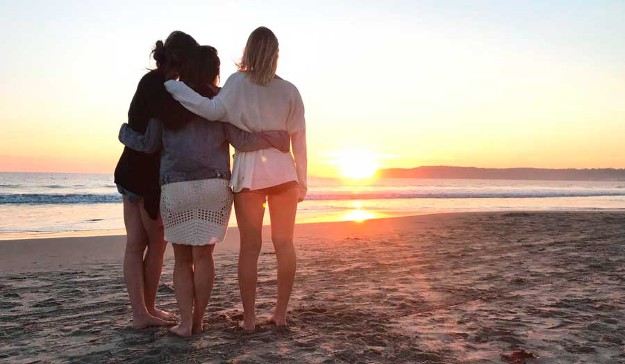 The author and her friends in Coronado Beach during sunset