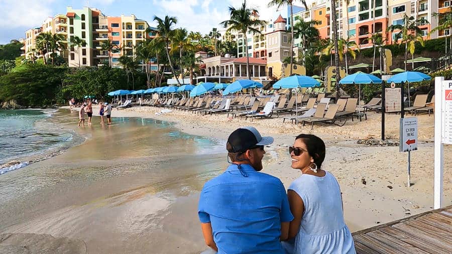 The author Andrew Bloem and his wife sitting on the footbridge and enjoying the beach at the Marriott