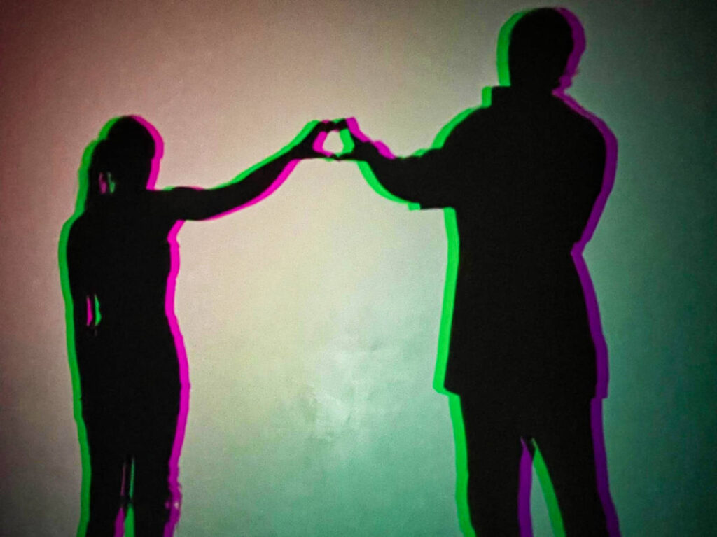 A couple's shadow with neon lights at Wonderspaces