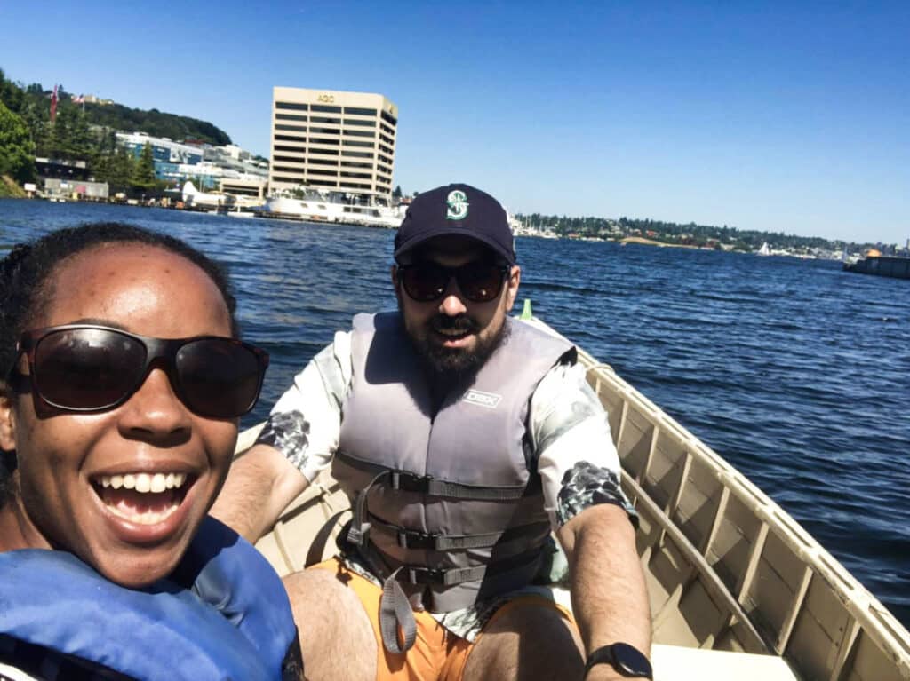 The author Chelsea Booker and her husband on a boat ride in The Center for Wooden Boats