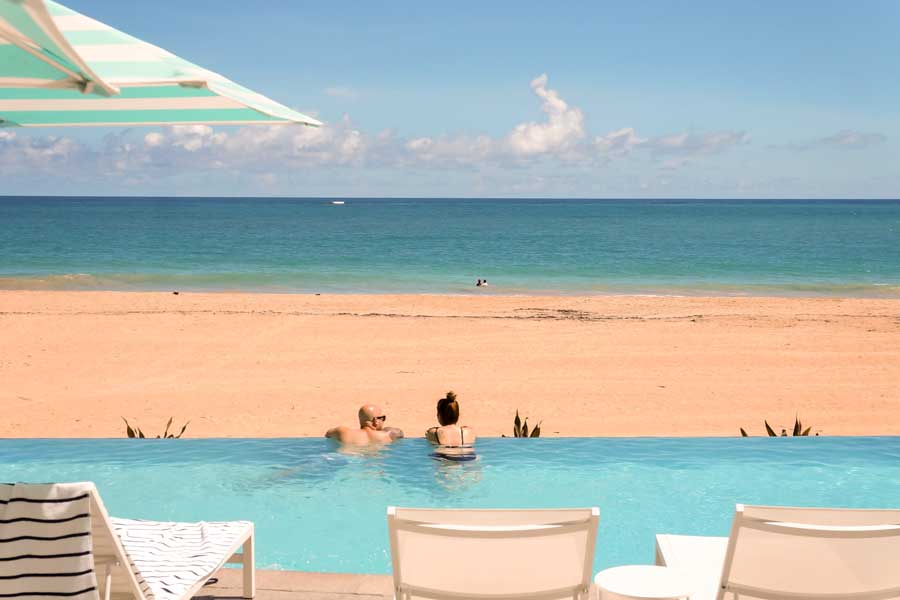A couple on a pool in La Concha Renaissance San Juan Resort