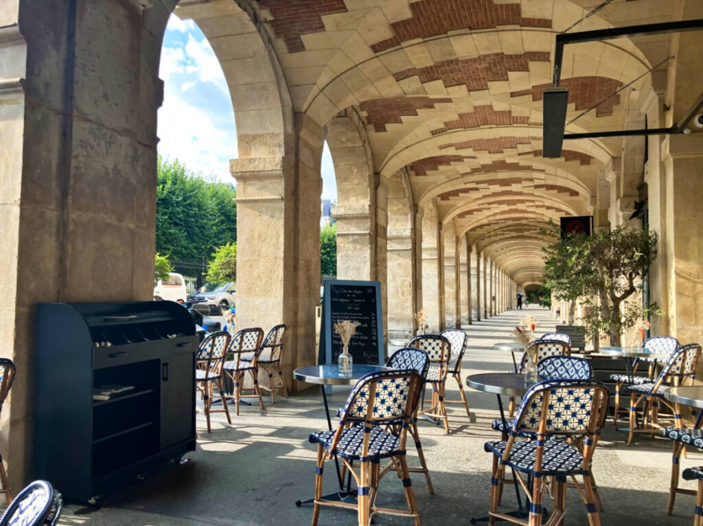 View of the picturesque outdoor seating area of Cour des Vosges Tearoom