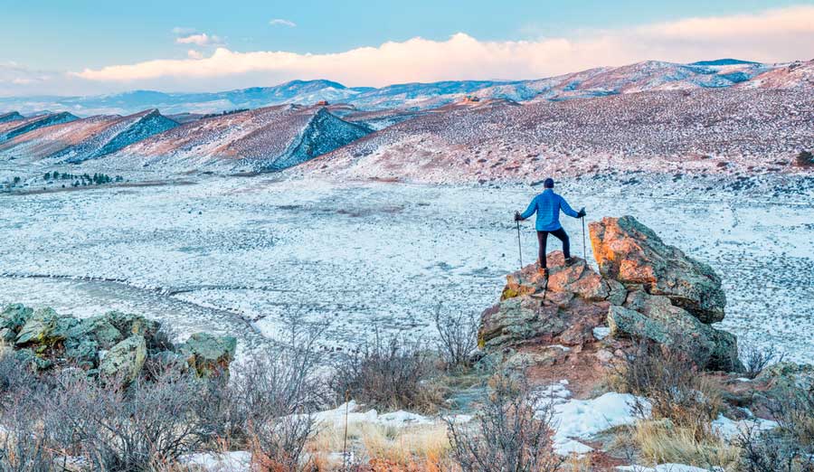 View of a hiker on top of a Coyote Ridge Trail during winter season