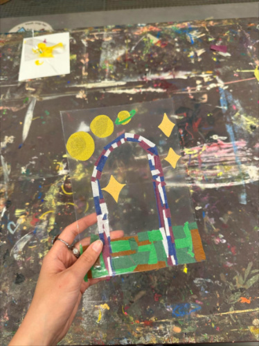 Holding the craft that author Lea Rose made at the museum