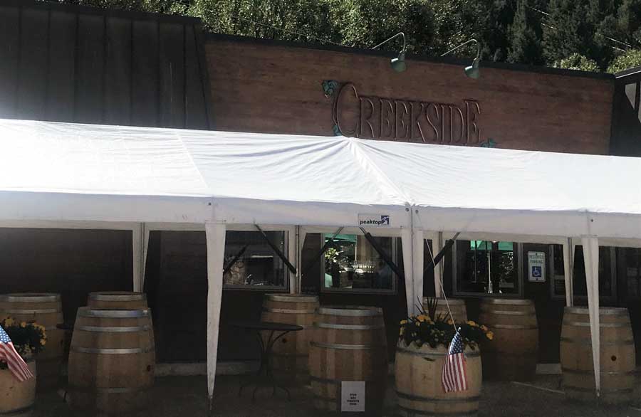Wine barrels displayed outside the Creekside Cellars