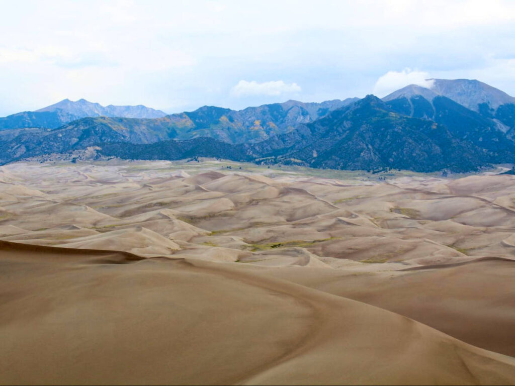 Panoramic view of the sand dunes with the mountain ranges in the background