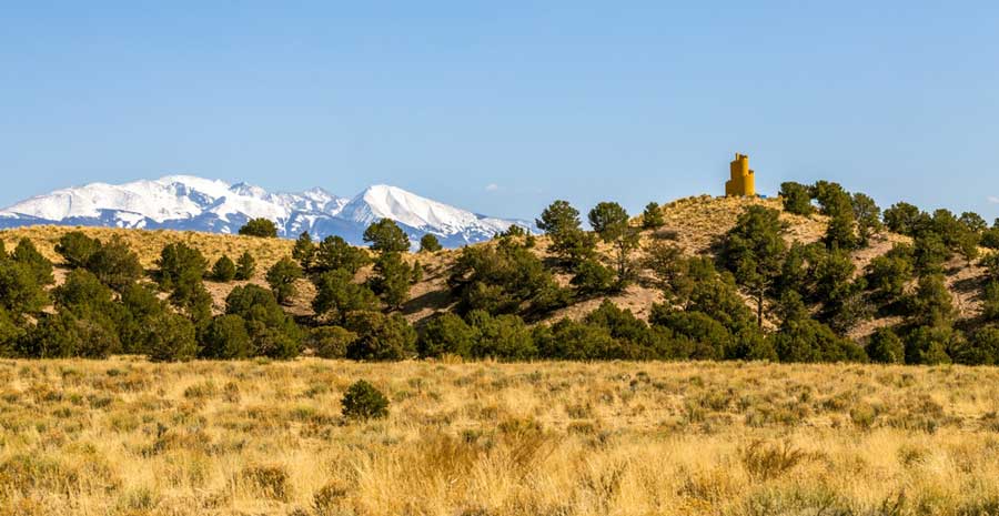 View of a snowy mountain from afar in Crestone