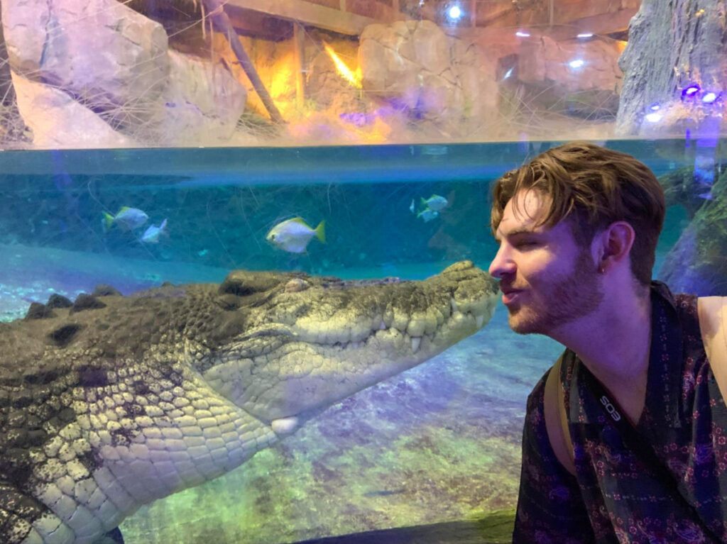 Author Betty's boyfriend getting up close with a crocodile