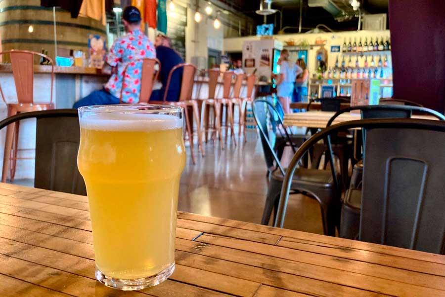 A glass of beer on top of a table in Crooked Stave